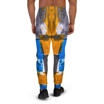 Men's joggers printed in blue, yellow and white blocks, with cuffed ankles.