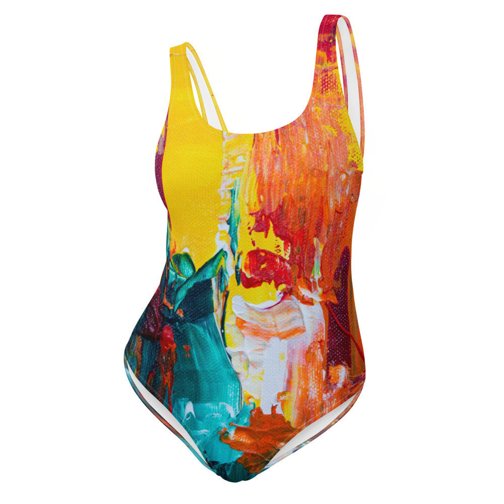 One-piece swimsuit printed in teal, orange and yellow brushwork, with a scoop back.
