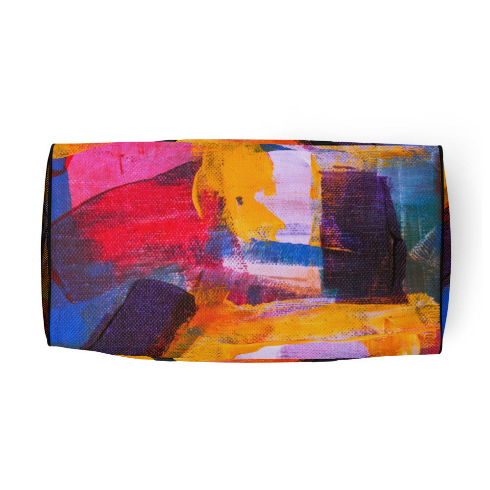 Travel duffle bag in orange, blue and cream brushwork, with an adjustable padded strap.