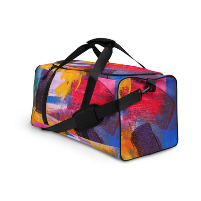 Travel duffle bag in orange, blue and cream brushwork, with an adjustable padded strap.