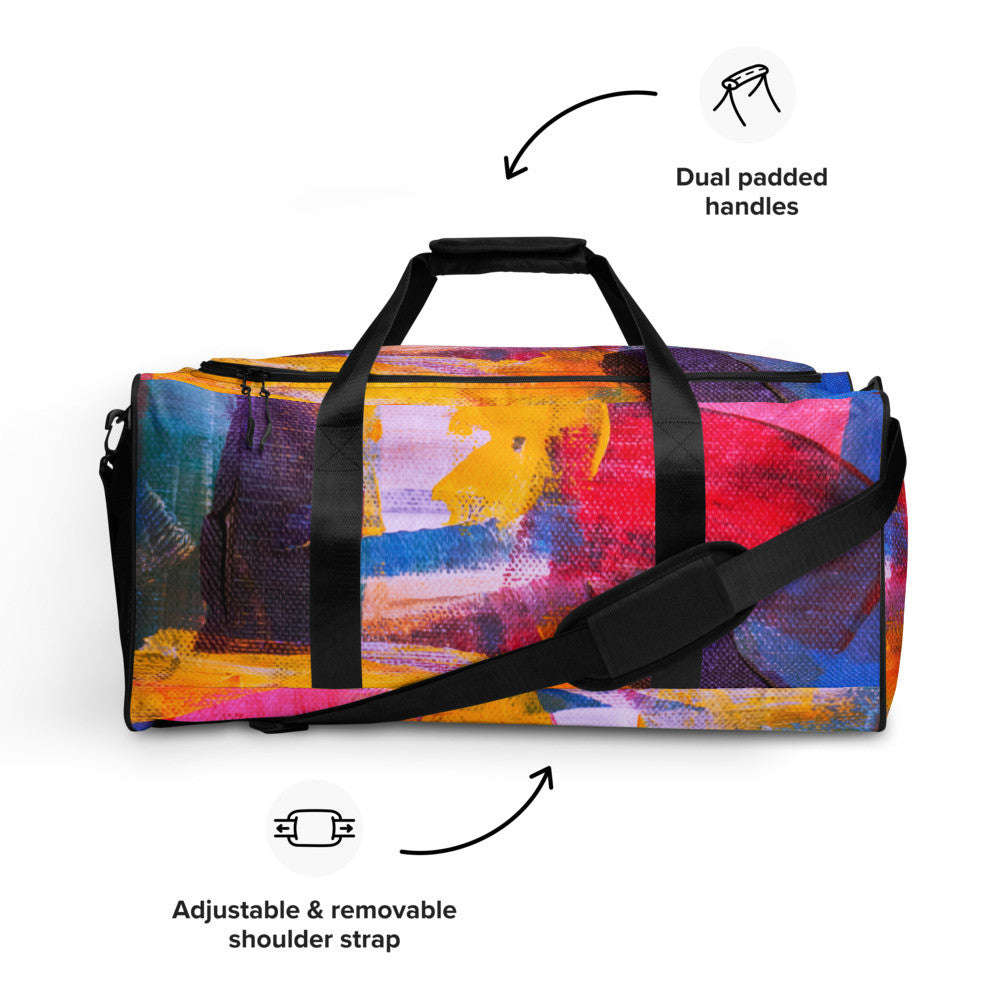 Travel duffle bag in orange, blue and cream brushwork, with an adjustable padded strap.