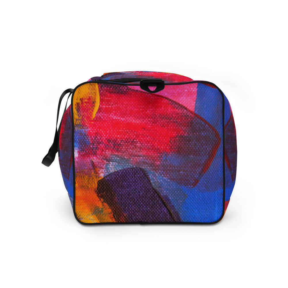 Travel duffle bag in orange, blue and cream brushwork, with an adjustable padded strap.