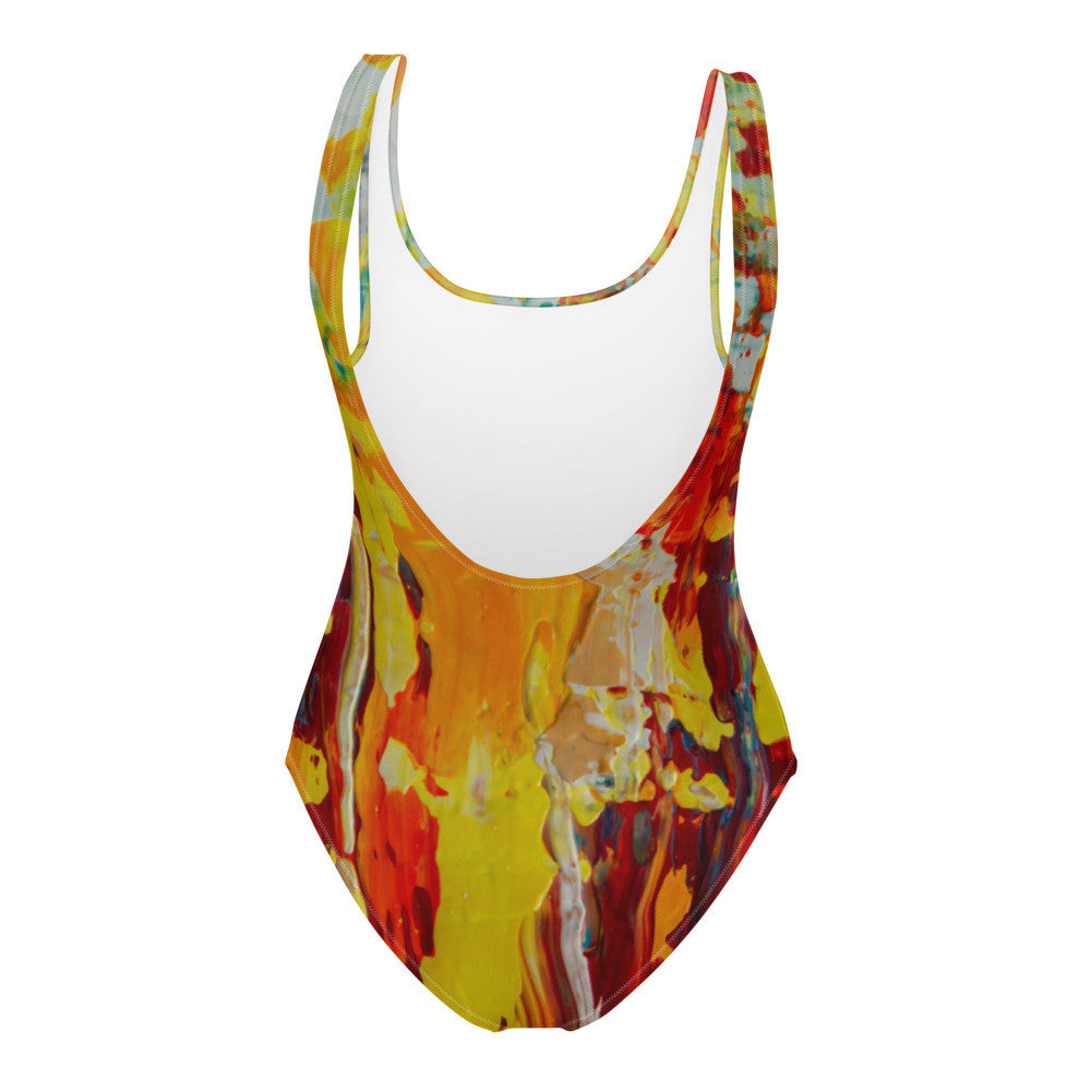 One-piece swimsuit printed in yellow, orange and red, with a cheeky cut and lined front.