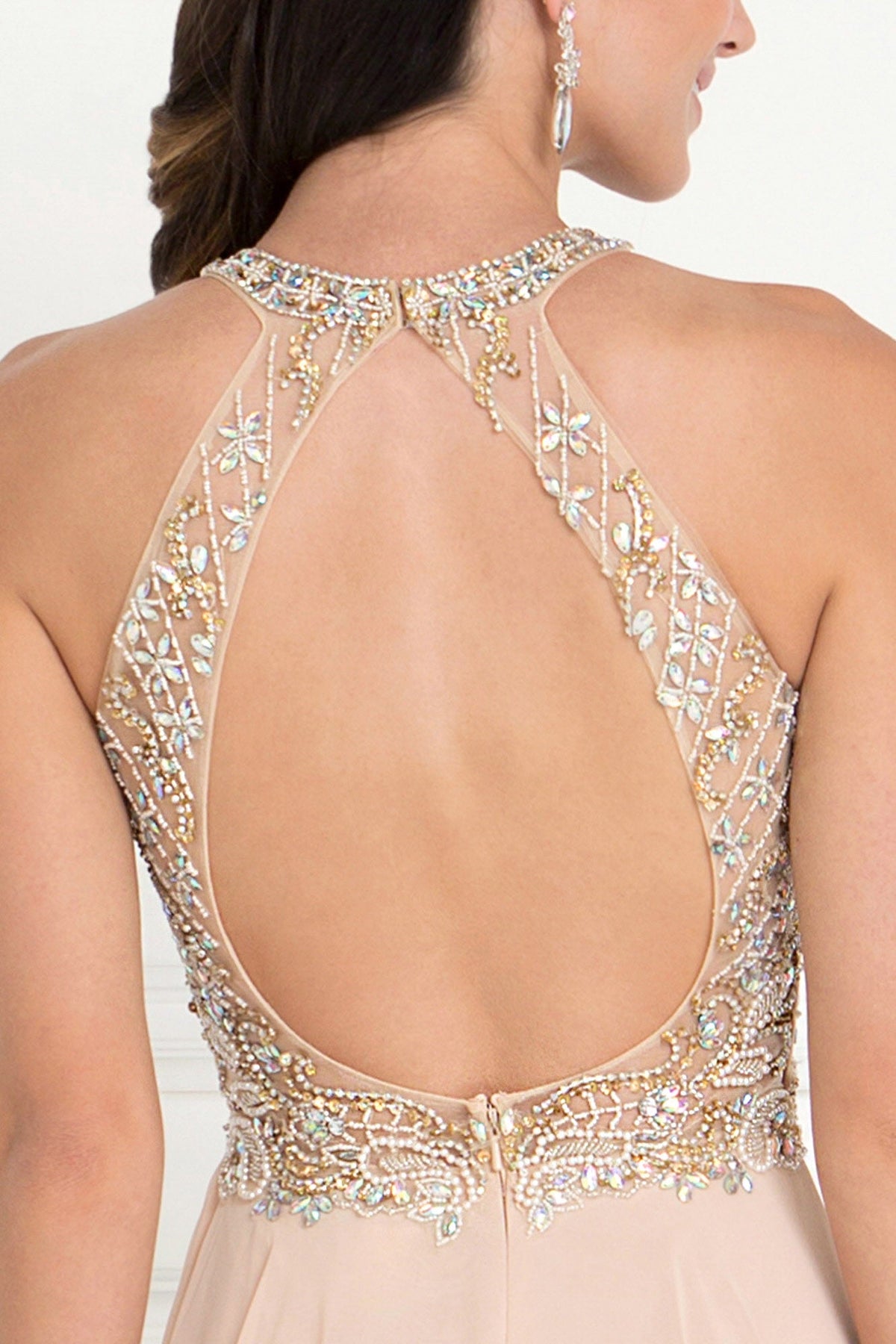 Champagne chiffon gown with jewel detail at the scoop neck and a full-length skirt.