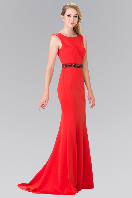 Red jersey mermaid gown with a crew neckline and a beaded cut-out back.
