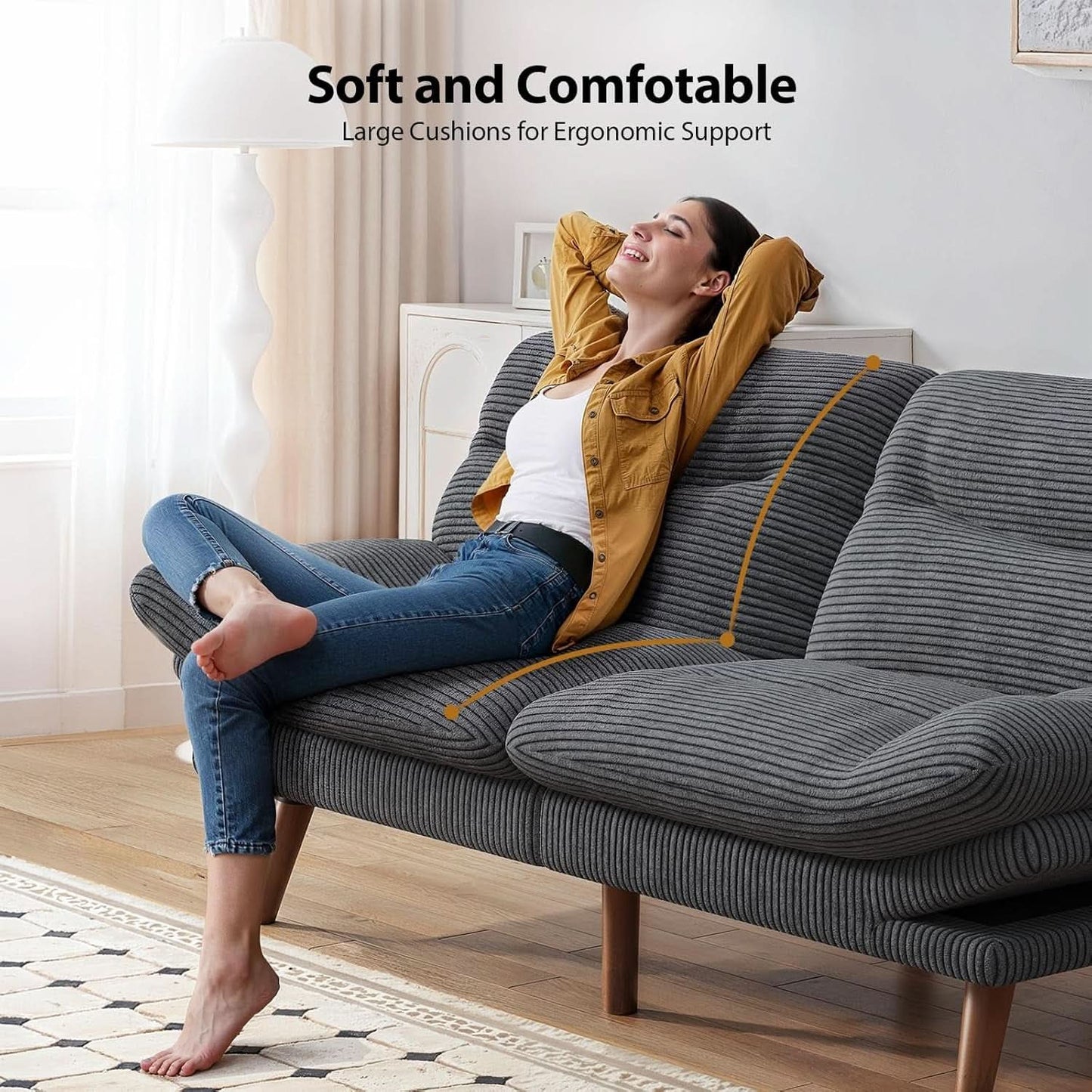 Gray corduroy sofa bed at 73 inches laid flat as a bed with the arms lowered.