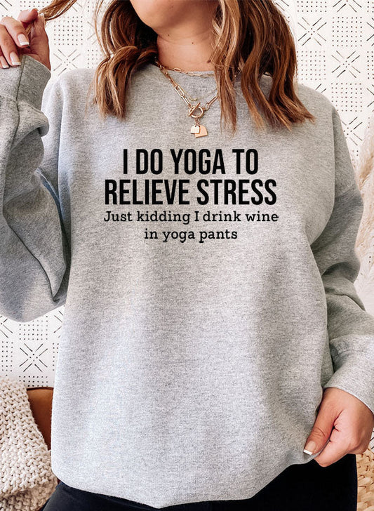 Athletic heather cotton fleece crewneck, yoga slogan printed across the chest.