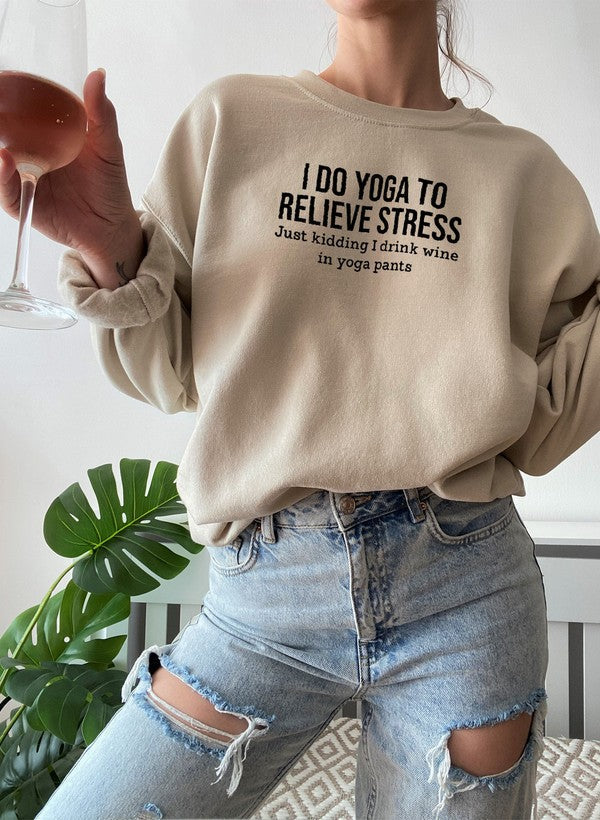 Beige cotton fleece crewneck, yoga slogan printed across the chest.