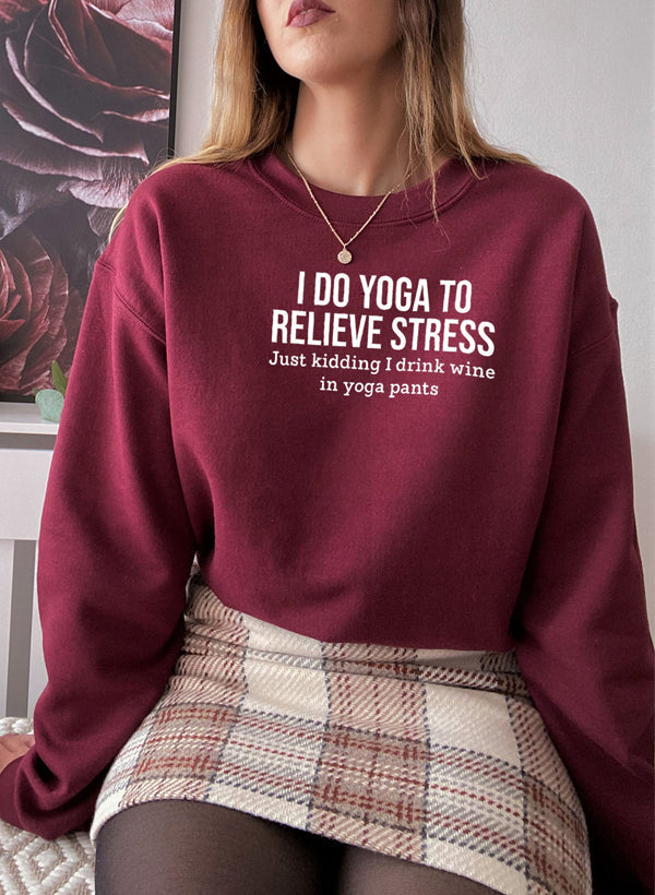 Maroon cotton fleece crewneck, yoga slogan printed across the chest.