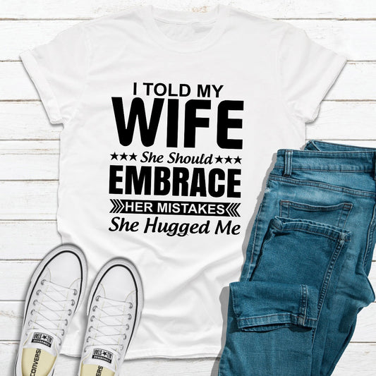 White cotton tee with the embrace-your-mistakes slogan printed across the chest.