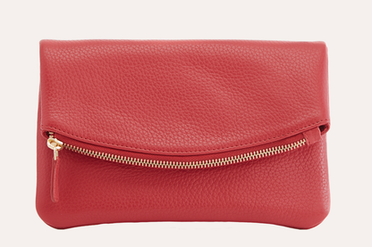 Red pebbled leather fold over clutch with a gold-tone zip running across the fold, front view