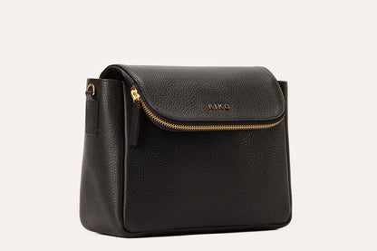 Black pebbled leather flap crossbody bag with a gold-tone zip along the flap edge, three-quarter view