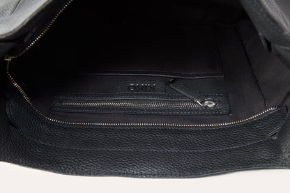 Inside the black hobo bag with the top zip open, showing the lining and a zip pocket on the inner wall