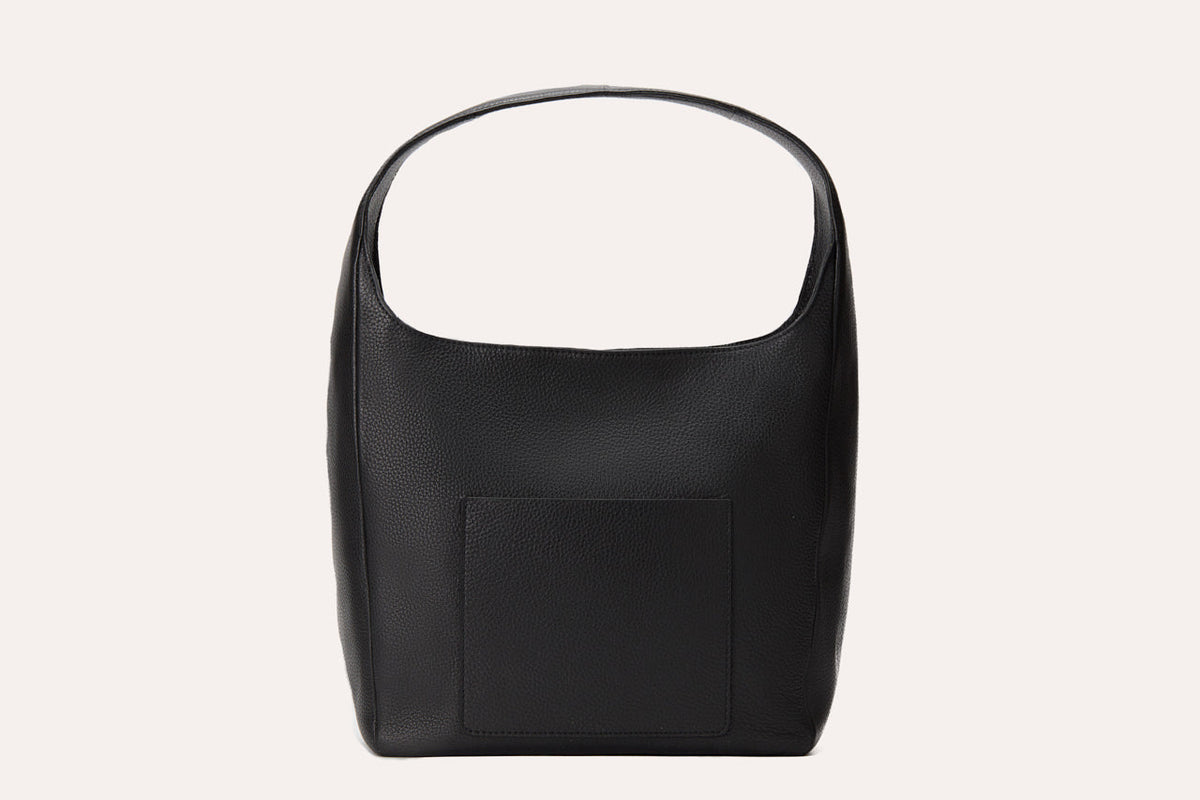 Back of the black hobo bag showing the outside slip pocket