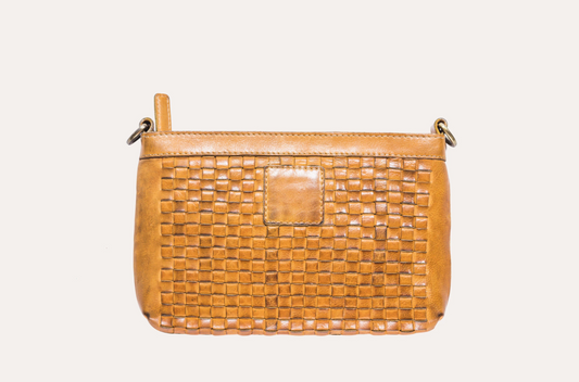 Tan woven leather crossbody bag with a top zip and a smooth leather patch on the front, front view