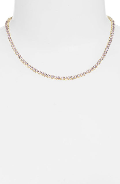 Lavender tennis necklace on a white bust form, a continuous line of pale purple stones at the base of the neck
