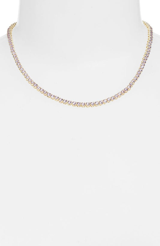 Lavender tennis necklace on a white bust form, a continuous line of pale purple stones at the base of the neck
