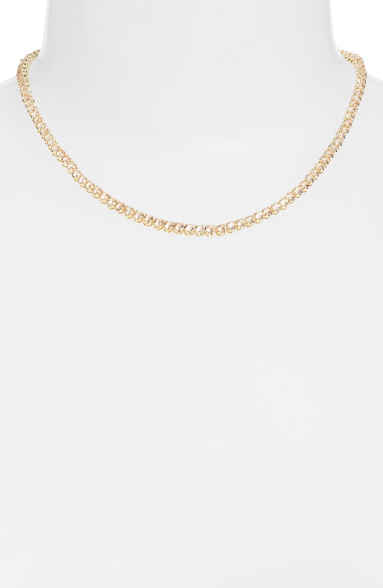 Topaz tennis necklace on a white bust form, a continuous line of champagne colored stones