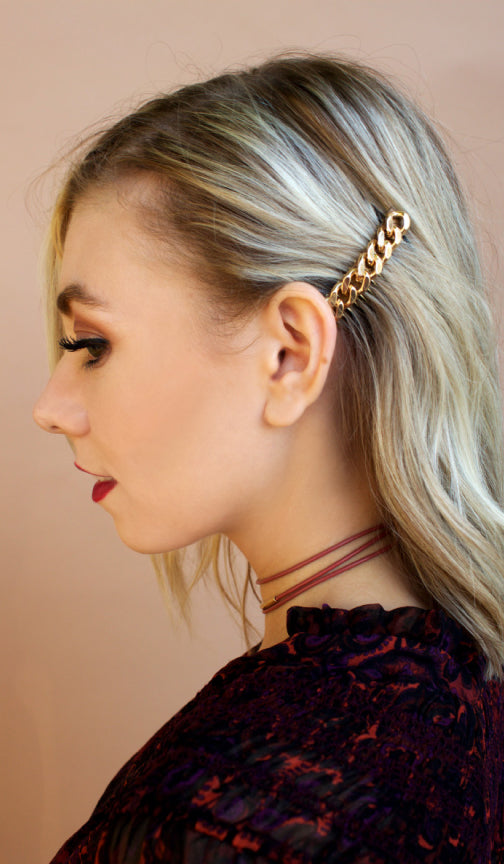 Side profile of a blonde model wearing the chain hair comb above her ear