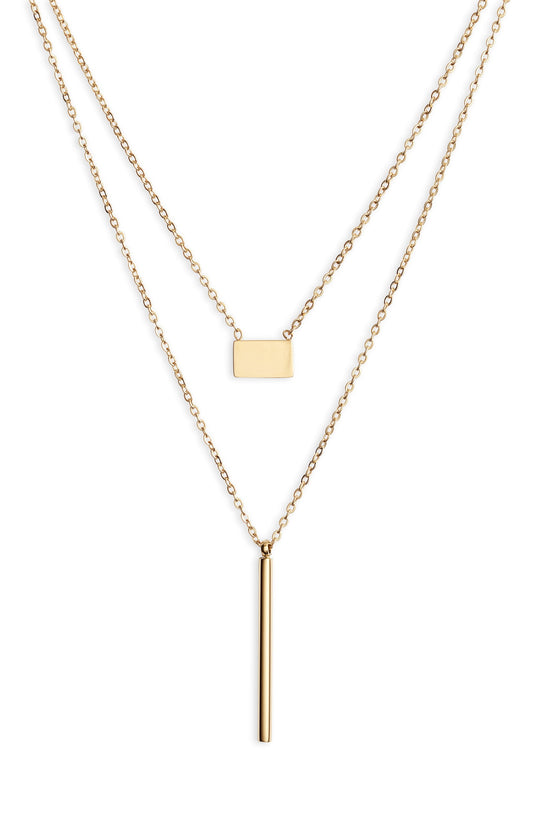 Two gold tone chains, the upper with a small flat rectangle and the lower with a long vertical bar