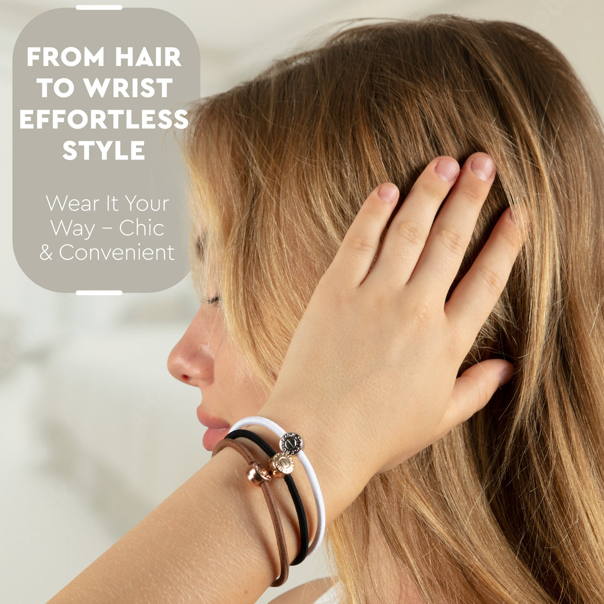 Model with black, white and brown hair ties worn as bracelets on her wrist