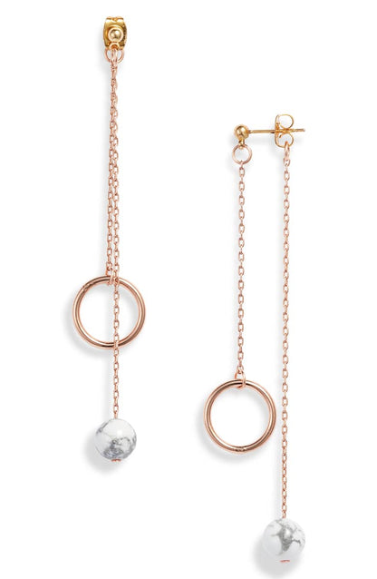 Rose gold plated chain drop earrings, each with an open ring and a white howlite bead on fine chains