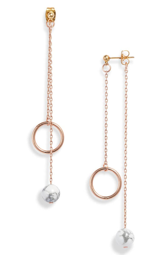 Rose gold plated chain drop earrings, each with an open ring and a white howlite bead on fine chains