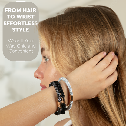 Side view of a model wearing metallic hair ties stacked on her wrist as bracelets