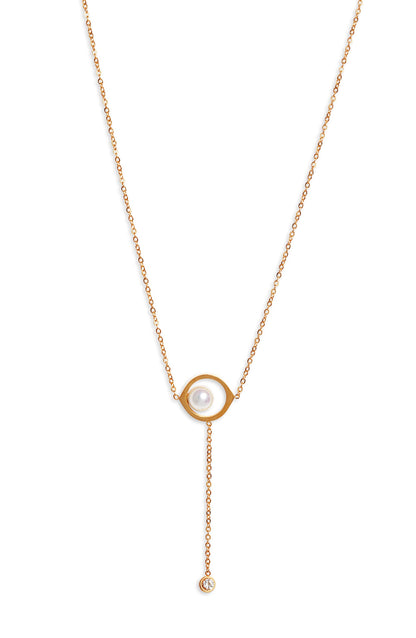 Y necklace with a white pearl inside an open almond shaped gold tone frame and a chain drop ending in a crystal