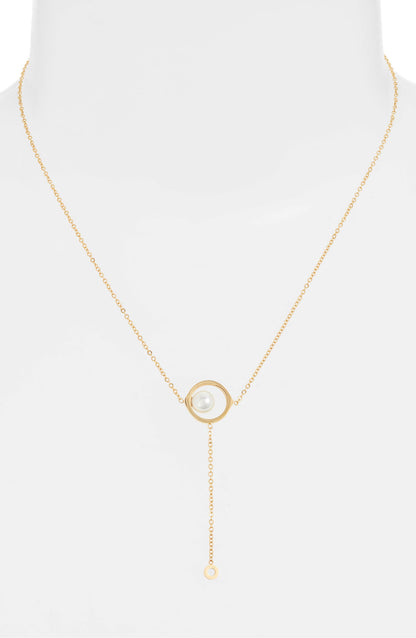 Pearl drop necklace on a white bust form, the pearl frame at the chest and the fine drop below it