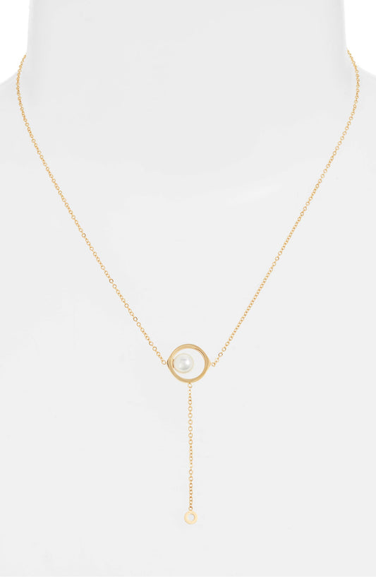 Pearl drop necklace on a white bust form, the pearl frame at the chest and the fine drop below it