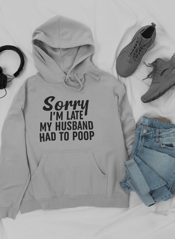 Athletic Heather hoodie laid flat with jeans, sneakers and headphones, slogan in black.