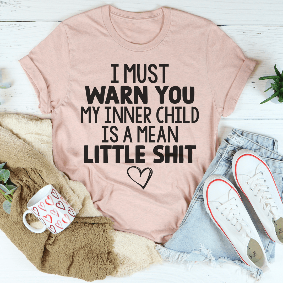 Heather prism peach unisex cotton tee laid flat, block-letter slogan printed across the chest.