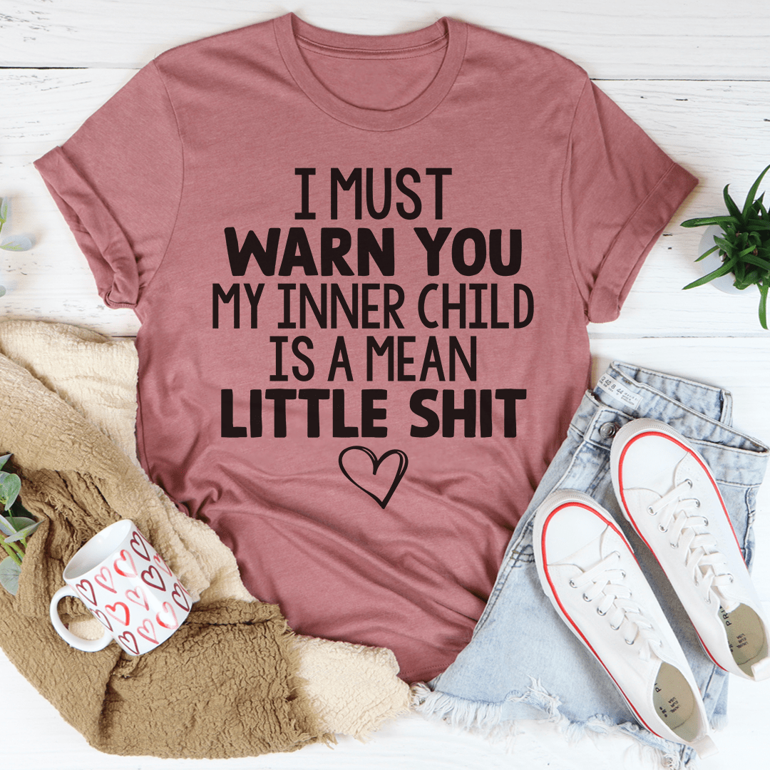 Mauve unisex cotton tee laid flat, block-letter slogan printed across the chest.