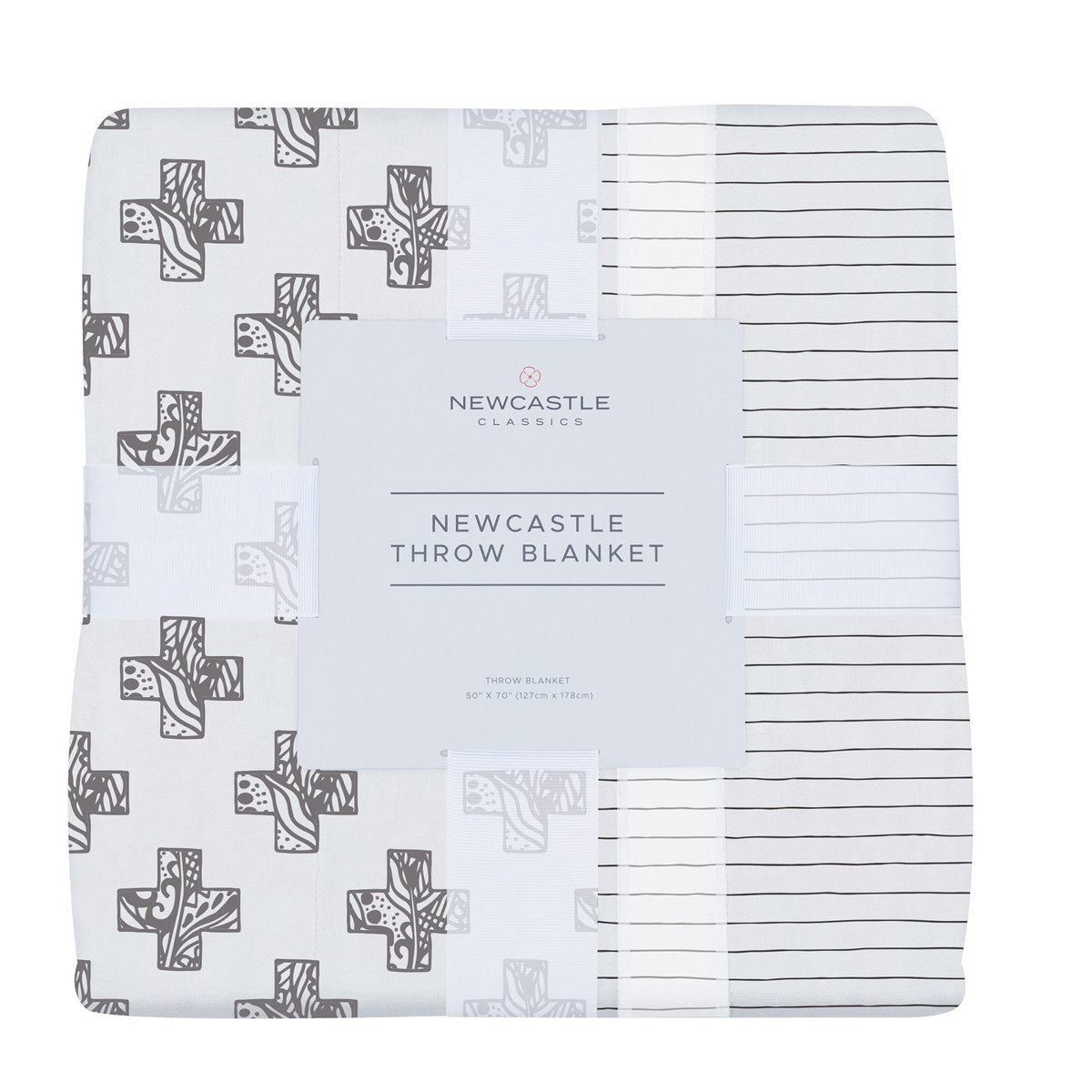 Folded bamboo muslin throw blanket in its band, printed with gray stamped crosses and thin dark pencil stripes