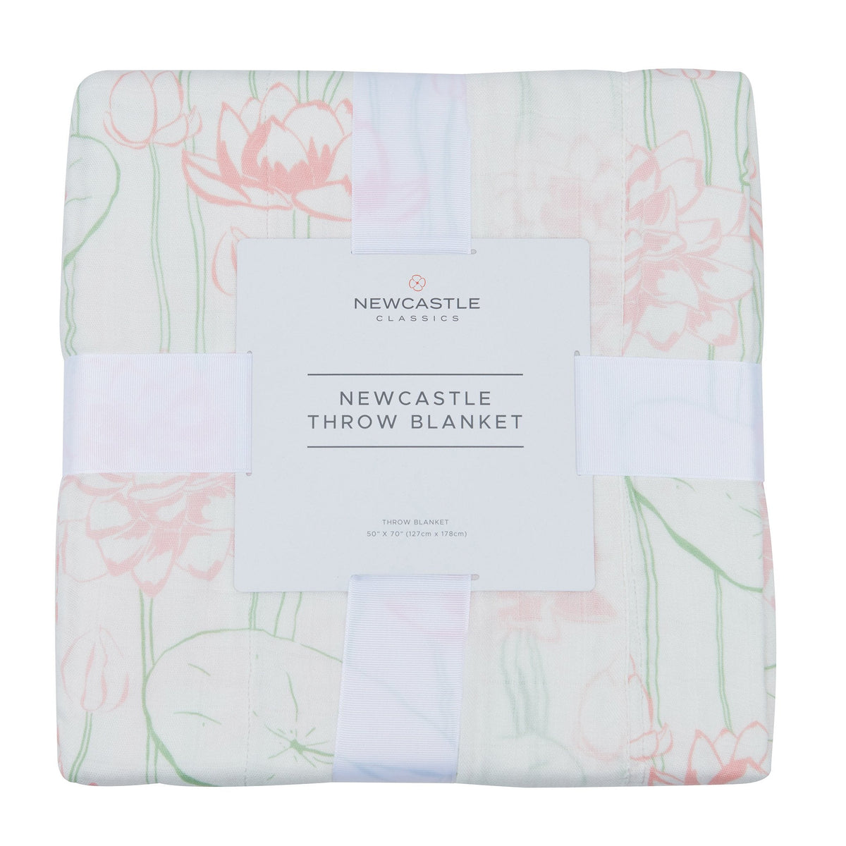 Folded bamboo muslin throw blanket in its band, printed with pink water lilies, lily pads and green stems