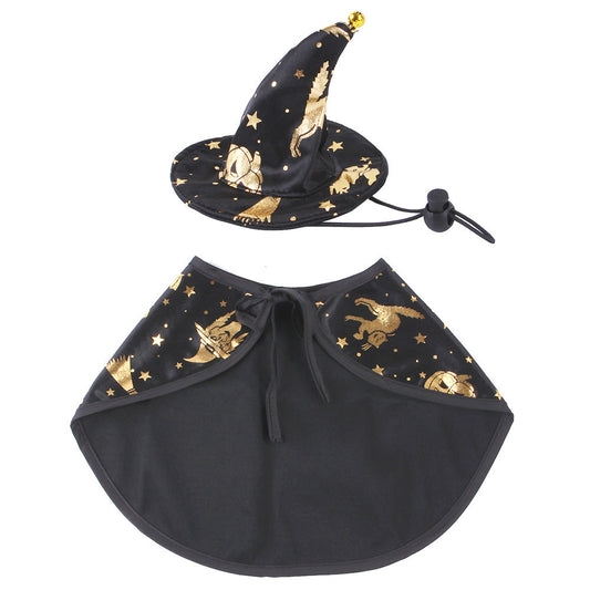 Black star print pet cape and matching pointed hat laid flat.