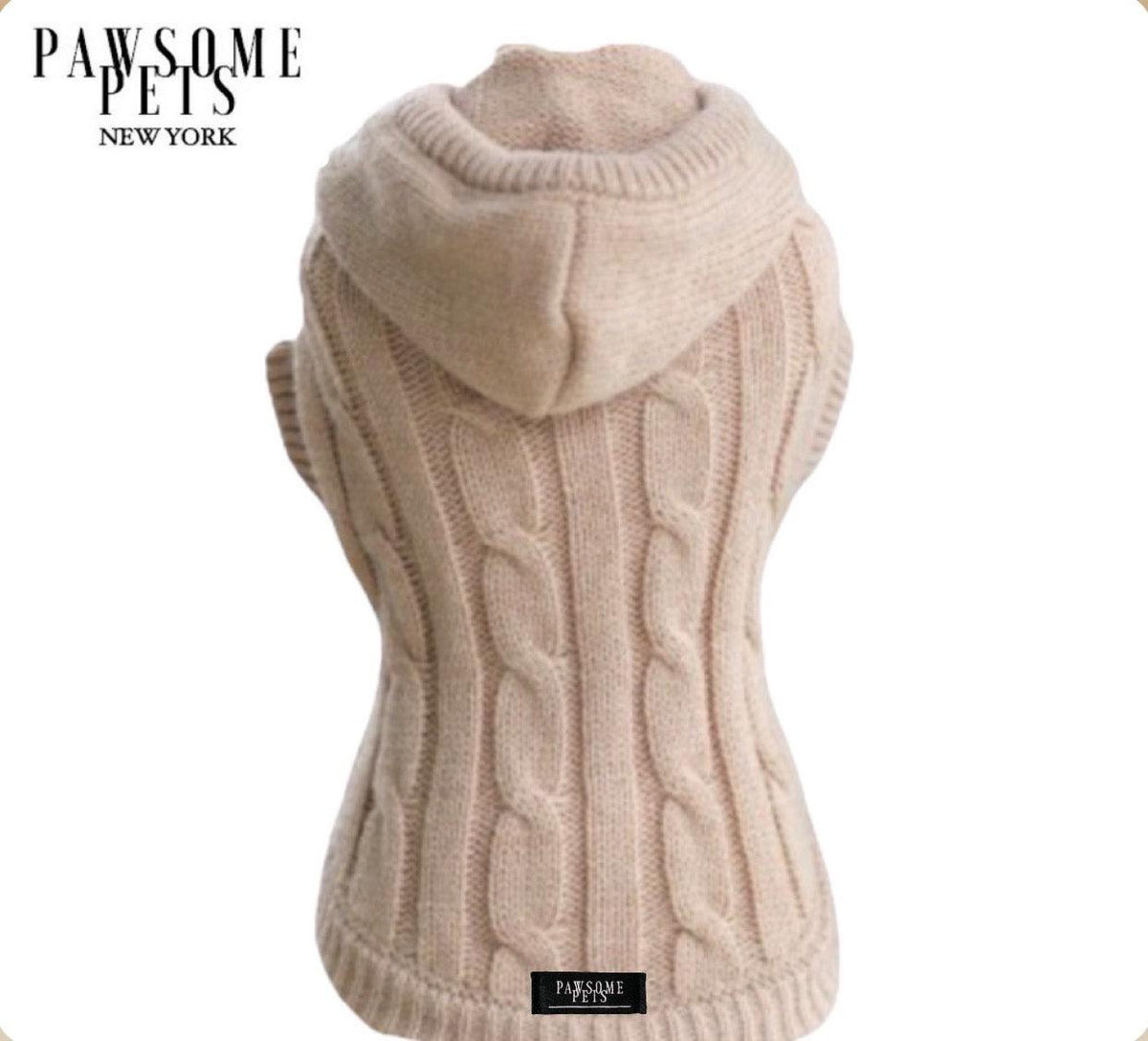 Beige cable knit dog sweater with an attached knitted hood, shown from the back
