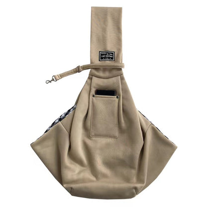 Khaki pet sling carrier laid flat, showing the drawstring opening.