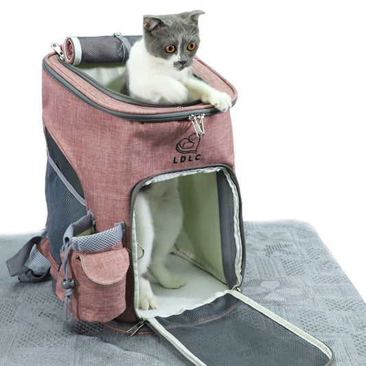 Pink soft sided pet backpack with a cat inside and the front flap open.