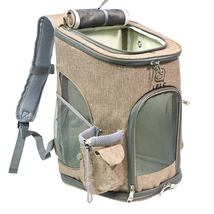 Beige soft sided pet backpack carrier with a rolled top handle.
