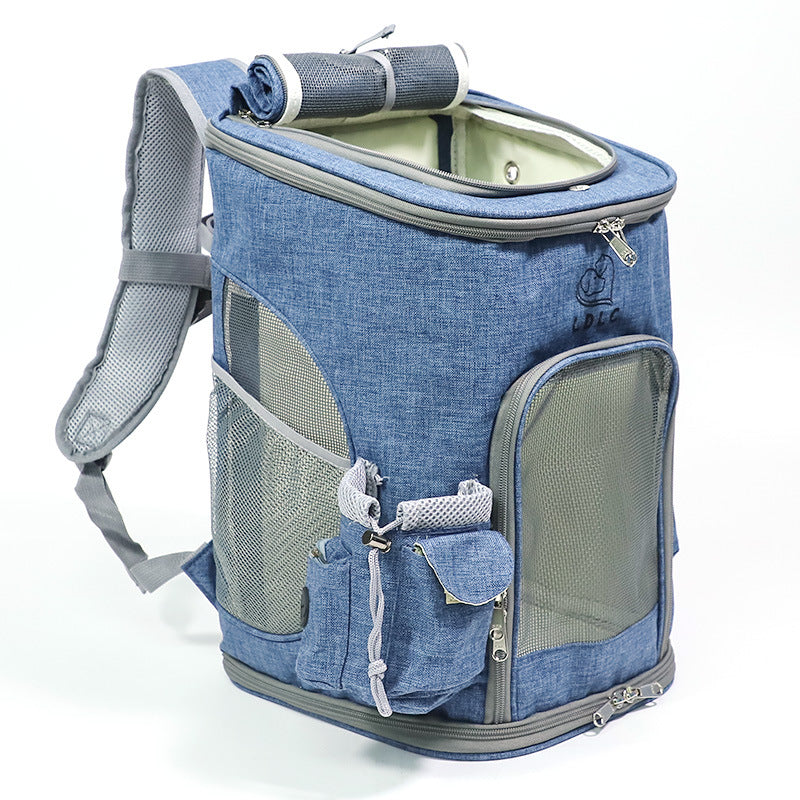 Blue soft sided pet backpack carrier with mesh side panels.