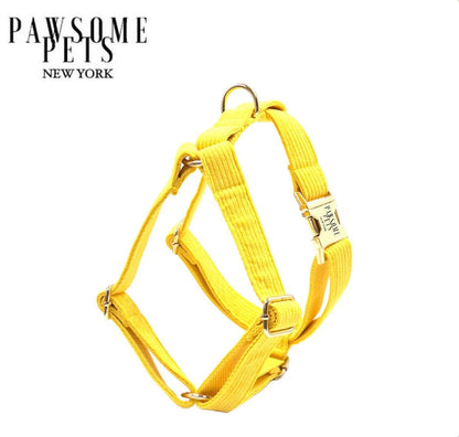 Bright yellow step-in dog harness in printed polyester webbing.