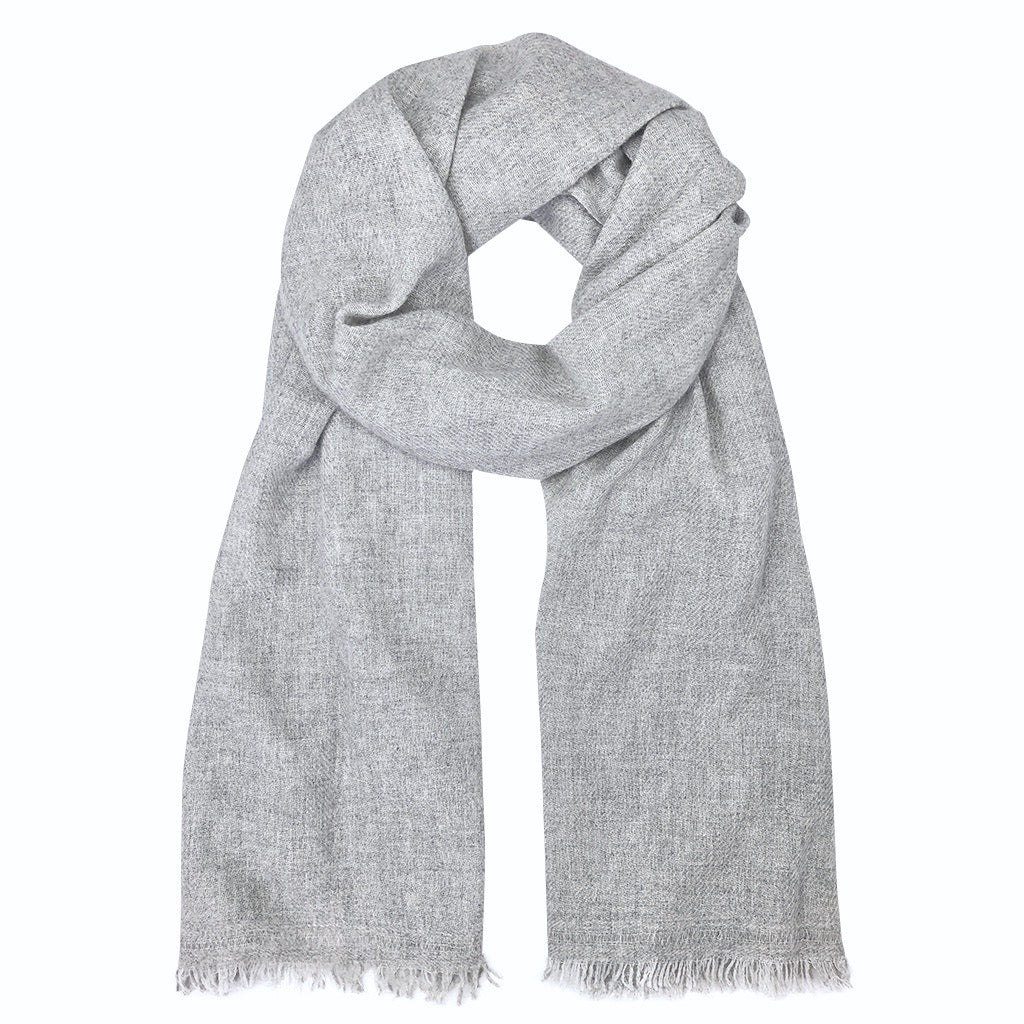 Heather gray cashmere scarf draped in a loop, fringed ends hanging down
