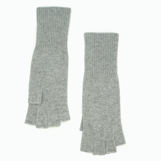 Light gray cashmere fingerless gloves laid flat with long ribbed cuffs