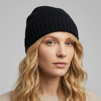 Black cashmere beanie on a model, honeycomb crown and ribbed cuff