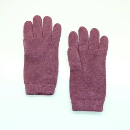 Dusty rose cashmere gloves laid flat with ribbed cuffs