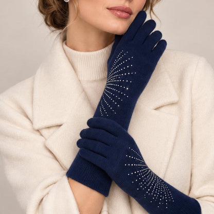 Model wearing navy long cashmere gloves with rhinestone rays over a cream coat