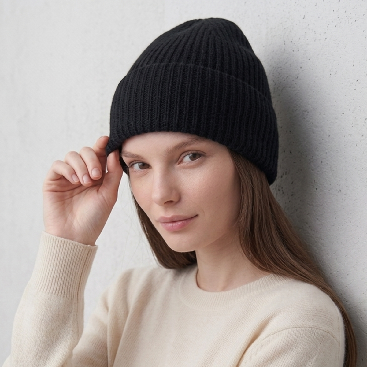 Model in the black ribbed cashmere hat with the cuff turned back