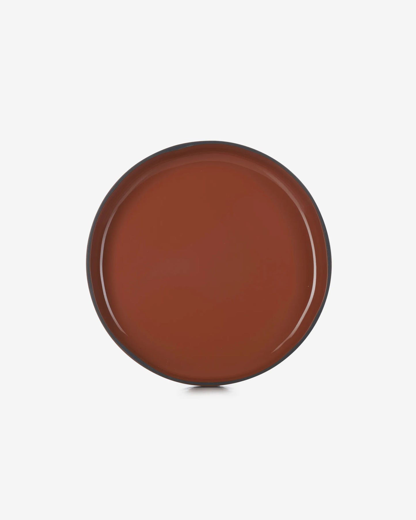 The cinnamon plate straight down from above, the full face and rim in view.